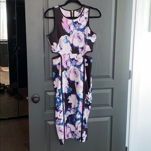Sleeveless floral cut out midi dress.